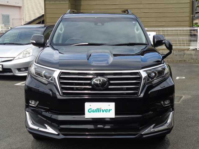 トヨタ ランドクルーザー プラド TX Lパッケージ 鹿児島県 2018(平30)年 0.4万km アティチュードブラックマイカ ワンオーナー/モデリスタエアロ/モデリスタマフラー/純正19インチAW/SOREXヒッチメンバー/サンルーフ/黒革シート(前席パワーシート)/温冷エアシート/横フィングリル/純正ナビ(NSZT-Y66T)/ブルートゥース、フルセグ/DVD再生、バックカメラ/レーダークルーズコントロール/オートハイビーム/カーテンエアバッグ/登録時走行距離3419km/ETC/取説、ナビ取説、オフロード取説/保証書、スマートキー2個あり