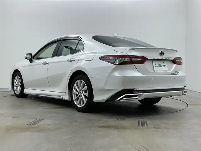 トヨタ カムリ G 岡山県 2023(令5)年 2.6万km プラチナホワイトパールマイカ 純正9インチディスプレイオーディオ(ナビ付)/【AM/FM/CarPlay/BT】/モデリスタエアロ(F/S/R)/パノラミックビューモニター/レーダークルーズコントロール/ビルトインＥＴＣ２．０/衝突軽減ブレーキ /ブラインドスポットモニター/純正アルミ/ドアバイザー/横滑り防止装置/オートLEDヘッドライト/オートハイビーム