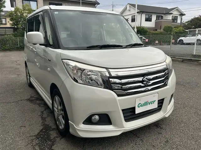 スズキ ソリオ HV MX Dカメラ ブレーキS 神奈川県 2016(平28)年 1.6万km ピュアホワイトP ・社外ナビ（AM、FM、CD、DVD、ブルートゥース、フルセグTV）/・純正フロアマット/・ETC/・ドライブレコーダー/・電動格納ミラー/・追従機能なしクルーズコントロール/・車線逸脱防止機能/・衝突警報ブレーキ/・アイドリングストップ/・横滑り防止機能/・ハロゲンヘッドライト/・フォグランプ/・盗難防止機能装置/・プッシュスタート（スマートキー）/・取扱説明書/・保証書