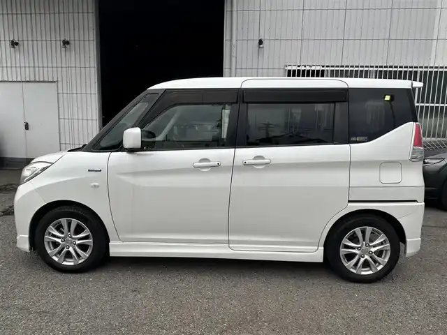 スズキ ソリオ HV MX Dカメラ ブレーキS 神奈川県 2016(平28)年 1.6万km ピュアホワイトP ・社外ナビ（AM、FM、CD、DVD、ブルートゥース、フルセグTV）/・純正フロアマット/・ETC/・ドライブレコーダー/・電動格納ミラー/・追従機能なしクルーズコントロール/・車線逸脱防止機能/・衝突警報ブレーキ/・アイドリングストップ/・横滑り防止機能/・ハロゲンヘッドライト/・フォグランプ/・盗難防止機能装置/・プッシュスタート（スマートキー）/・取扱説明書/・保証書