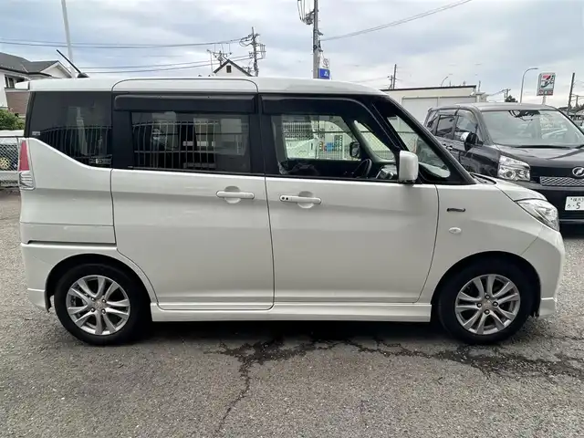 スズキ ソリオ HV MX Dカメラ ブレーキS 神奈川県 2016(平28)年 1.6万km ピュアホワイトP ・社外ナビ（AM、FM、CD、DVD、ブルートゥース、フルセグTV）/・純正フロアマット/・ETC/・ドライブレコーダー/・電動格納ミラー/・追従機能なしクルーズコントロール/・車線逸脱防止機能/・衝突警報ブレーキ/・アイドリングストップ/・横滑り防止機能/・ハロゲンヘッドライト/・フォグランプ/・盗難防止機能装置/・プッシュスタート（スマートキー）/・取扱説明書/・保証書
