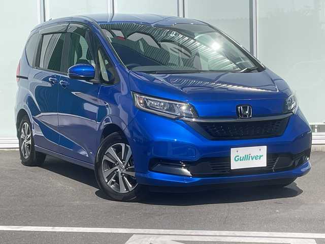 ホンダ フリード ハイブリット G 神奈川県 2023(令5)年 1.1万km プレミアムクリスタルブルークリスタル 純正SDナビ　iPod/Bluetooth/CD/DVD/ワンセグTV /両側パワースライドドア /バックカメラ　/レーダークルーズコントロール　/前後ドライブレコーダー　/コーナーセンサー　/ビルトインETC　/前席シートヒーター/純正アルミホイール　/純正フロアマット