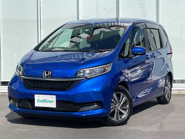 ホンダ フリード ハイブリット G 神奈川県 2023(令5)年 1.1万km プレミアムクリスタルブルークリスタル 純正SDナビ　iPod/Bluetooth/CD/DVD/ワンセグTV /両側パワースライドドア /バックカメラ　/レーダークルーズコントロール　/前後ドライブレコーダー　/コーナーセンサー　/ビルトインETC　/前席シートヒーター/純正アルミホイール　/純正フロアマット