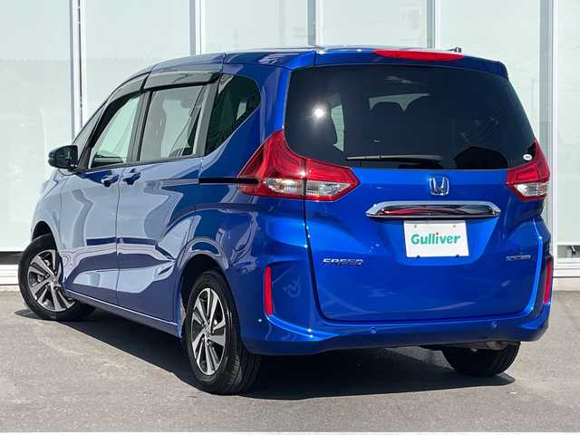 ホンダ フリード ハイブリット G 神奈川県 2023(令5)年 1.1万km プレミアムクリスタルブルークリスタル 純正SDナビ　iPod/Bluetooth/CD/DVD/ワンセグTV /両側パワースライドドア /バックカメラ　/レーダークルーズコントロール　/前後ドライブレコーダー　/コーナーセンサー　/ビルトインETC　/前席シートヒーター/純正アルミホイール　/純正フロアマット