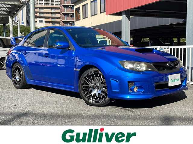 スバル インプレッサ ＷＲＸ STi 神奈川県 2012(平24)年 15.1万km WRブルーマイカ 4WDターボ/社外HDDナビ【AVIC-ZH99】/・DTV/CD/DVD/MSV/BT/バックカメラ/ハーフレザーシート/D席パワーシート/リアスポイラー/社外18インチAW【BSJ】/社外マフラー【フジツボ】/ドライブレコーダー/ETC/横滑り防止機能/革巻きステアリング/プッシュEgスタート/ストップ/スマートキー×2/純正HIDヘッドライト/フロント/バックフォグ/ターンランプ付き電動格納ドアミラー/社外フロアマット