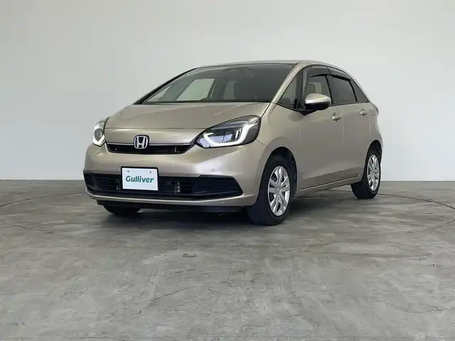 ホンダ フィット e:HEVホーム 群馬県 2023(令5)年 5.1万km 茶 社外ナビ　バックカメラ　追従式クルコン　衝突軽減システム　ホンダセンシング　横滑り防止　ＥＴＣ　オートマチックハイビーム　レーンアシスト　スマートキー　プッシュスタート　ＬＥＤヘッドライト　禁煙車