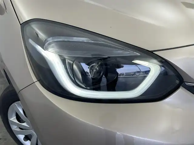 ホンダ フィット e:HEVホーム 群馬県 2023(令5)年 5.1万km 茶 社外ナビ　バックカメラ　追従式クルコン　衝突軽減システム　ホンダセンシング　横滑り防止　ＥＴＣ　オートマチックハイビーム　レーンアシスト　スマートキー　プッシュスタート　ＬＥＤヘッドライト　禁煙車