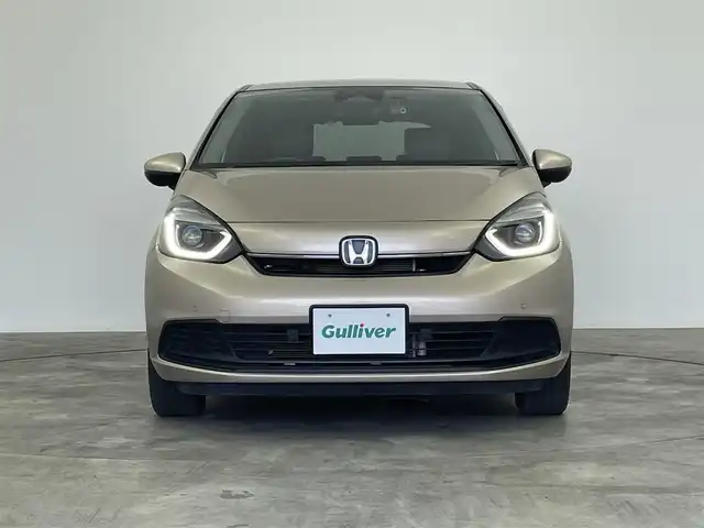 ホンダ フィット e:HEVホーム 群馬県 2023(令5)年 5.1万km 茶 社外ナビ　バックカメラ　追従式クルコン　衝突軽減システム　ホンダセンシング　横滑り防止　ＥＴＣ　オートマチックハイビーム　レーンアシスト　スマートキー　プッシュスタート　ＬＥＤヘッドライト　禁煙車