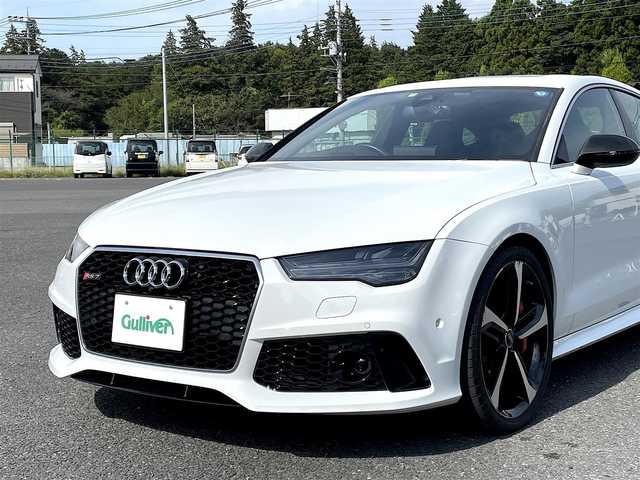 アウディ ＲＳ７ スポーツバック 千葉県 2015(平27)年 2.7万km グレイシアホワイトメタリック 色コード:LS9R（グレイシアホワイトメタリック）/純正HDDナビ/フルセグTV/BOSEサウンドシステム/サンルーフ/黒レザーシート/前後カメラ/純正21インチAW/レッドキャリパー/RSスポーツエグゾースト/４ゾーンエアコン/レーダークルーズコントロール/衝突軽減ブレーキ/レーンキープアシスト/ブラインドスポットモニター/マトリックスLEDヘッドライト/カーボンミラーカバー/取扱説明書/スペアキー