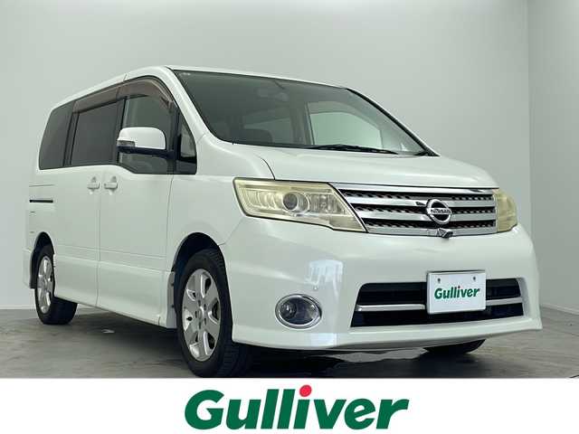日産 セレナ ハイウェイスター Vセレクション 大阪府 2009(平21)年 9.9万km ホワイトパール 純正7インチHDDナビ/・TV/・CD/DVD/アラウンドビューモニター/純正フリップダウンモニター/純正16インチAW/純正HIDヘッドライト/・オートライト/純正ビルトインETC/両側パワースライドドア/100V充電/スマートキー×２/CLEAN ION エアコン