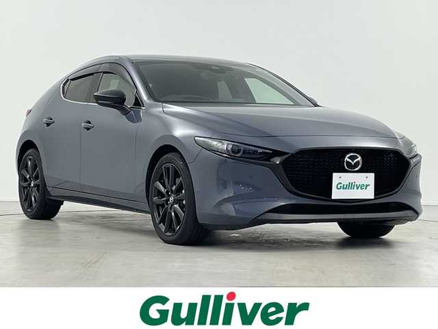 マツダ マツダ３ファストバック XD ブラックトーンED 岐阜県 2022(令4)年 2万km ポリメタルグレーM 純正ナビ/CD/DVD/Bluetooth/USB/HDMI/フルセグTV/全周囲カメラ/衝突被害軽減ブレーキ/レーンキープアシスト/ブラインドスポットモニター/パーキングセンサー/オートマチックハイビーム/クルージング＆トラフィック・サポート/レーダークルーズコントロール/ヘッドアップディスプレイ/ステアリングヒーター/シートヒーター/パワーシート/前後ドライブレコーダー/ETC/オートLEDヘッドライト/電動パーキングブレーキ/ステアリングリモコン/革巻きステアリング/パドルシフト/左右独立エアコン/電動格納ミラー