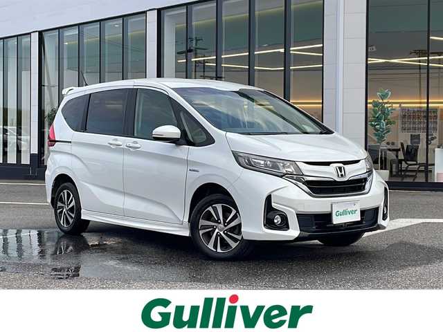 ホンダ フリード ハイブリット G ホンダセンシング 新潟県 2017(平29)年 8.1万km ホワイトオーキッドパール ワンオーナー/純正ナビ　ＴＶ/LEDライト/Bluetooth/両側パワースライドドア/シートヒーター/ステアリングスイッチ/ビルトインETC/前方ドライブレコーダー/カーテンエアバッグ/パーキングアシスト/純正フロアマット/クルーズコントロール/ハーフレザーシート/バックカメラ