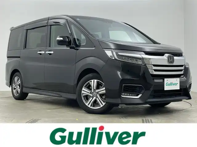 ホンダ ステップワゴン スパーダ eHEV G ホンダS 岡山県 2020(令2)年 5.1万km プレミアムスパークルブラックパール 純正9インチメモリナビ/（CD/DVD/Bluetooth/フルセグ/HDMI）/純正11.6インチフリップダウンモニター/ビルトインETC2.0/両側パワースライドドア/LEDヘッドライト/バックカメラ/レーダークルーズコントロール/前後ドライブレコーダー/レーンキープアシスト/プッシュスタート/スマートキー×2/ドアバイザー/フロアマット