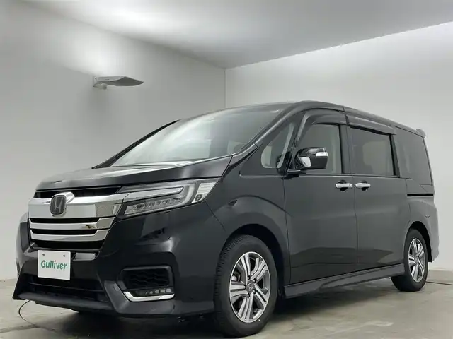 ホンダ ステップワゴン スパーダ eHEV G ホンダS 岡山県 2020(令2)年 5.1万km プレミアムスパークルブラックパール 純正9インチメモリナビ/（CD/DVD/Bluetooth/フルセグ/HDMI）/純正11.6インチフリップダウンモニター/ビルトインETC2.0/両側パワースライドドア/LEDヘッドライト/バックカメラ/レーダークルーズコントロール/前後ドライブレコーダー/レーンキープアシスト/プッシュスタート/スマートキー×2/ドアバイザー/フロアマット