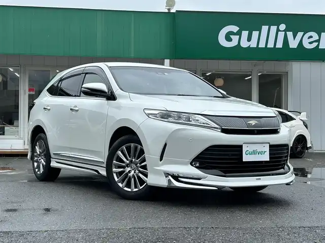 トヨタ ハリアー プログレス 千葉県 2020(令2)年 4.9万km ホワイトパールクリスタルシャイン モデリスタエアロ/JBLプレミアムサウンド/純正SDナビ/・CD/DVD/Blu-ray/MSV/Bluetooth/フルセグ/パノラミックビューカメラ/トヨタセーフティーセンス/・プリクラッシュセーフティー/・レーンディパーチャーアラート/・オートマチックハイビーム/・インテリジェントクリアランスソナー/・アダプティブクルーズコントロール/スマートキー/ハーフレザーシート/運転席パワーシート/パワーバックドア/前後コーナーセンサー/純正18インチアルミホイール/ウッドコンビステアリング/純正前後ドライブレコーダー【TZ-D205W】/ビルトインETC/木目調パネル/ドアバイザー/サイド＆カーテンエアバッグ/新車時保証書＆取扱説明書