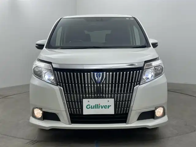 トヨタ エスクァイア ハイブリッド Gi 岡山県 2015(平27)年 7万km ホワイトパールクリスタルシャイン 社外9インチナビ(X900)/(Bluetooth/CD/DVD/フルセグTV)/社外10.1インチ後席モニター(TMX-RM300S)/両側電動スライドドア/合皮シート/シートヒーター(運転席・助手席)/バックカメラ/置くだけ充電/ドアバイザー/クルーズコントロール/純正LEDヘッドライト/オートライト/スマートキー(1本)/純正フロアマット/純正アルミホイール/ビルトインETC/アイドリングストップ