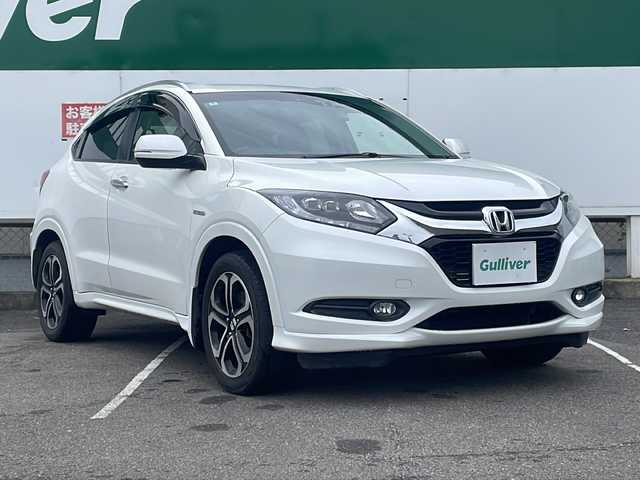 ホンダ ヴェゼル ハイブリッド Z 福島県 2014(平26)年 8.2万km ホワイトオーキッドパール 純正ナビゲーション/・フルセグTV/BT/CD/DVD/USB/HDMI/iPod/FM/AM/・バックカメラ/・前後ドライブレコーダー/・ビルトインETC/ハーフレザーシート/・シートヒーター/革張りステアリング/・ステアリングリモコン/・パドルシフト/クルーズコントロール/電子パーキング/・オートブレーキホールド/横滑り防止装置/プッシュスタート/・スマートキー/電動格納ミラー/・ウィンカーミラー/LEDヘッドライト/・オートライト/・フォグランプ/純正フロアマット/ドアバイザー/ルーフレール