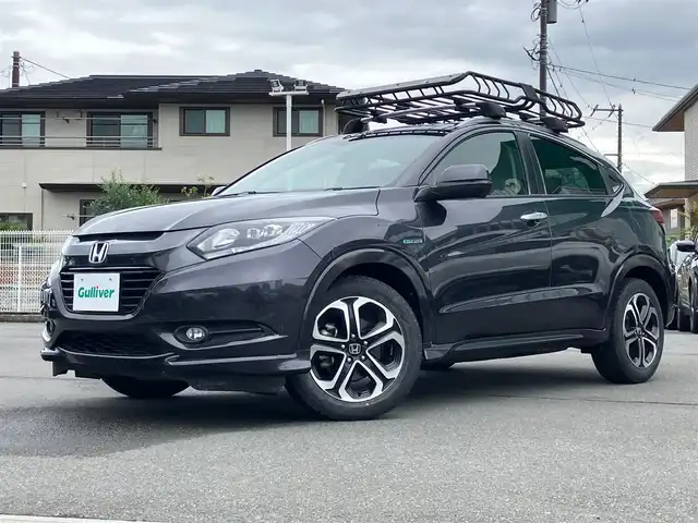 ホンダ ヴェゼル ハイブリッド Z 静岡県 2014(平26)年 3.4万km ルーセブラックM エンジンスタートボタン/保証書/取扱説明書/記録簿/パワーステアリング/パワーウィンドウ/MTモード付きAT/寒冷地仕様/アイドリングストップ/オートエアコン/スマートキー/スペアキー１本/クルーズコントロール/ETC/USB入力端子/バックカメラ/純正ナビ(CD.BTフルセグ)/純正フロアマット/純正アルミホイール/ハーフレザー/D席N席シートヒーター/ルーフレール/ABS/横滑り防止装置/オートライト/LEDライト/W+サイドエアバック/カーテンエアバック/衝突軽減システム