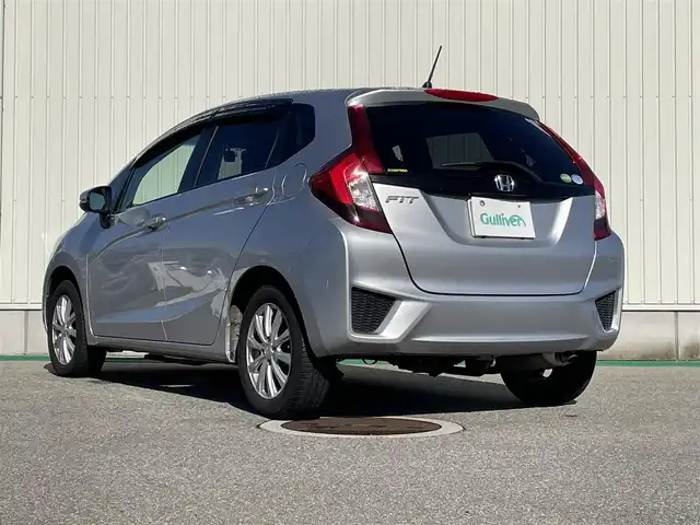 ホンダ フィット 13G Lパッケージ 富山県 2014(平26)年 5.6万km アラバスターシルバーメタリック ４ＷＤ／/ワンオーナー／/純正７インチナビ／/ワンセグＴＶ／/Ｂｌｕｅｔｏｏｔｈ／/ＤＶＤ再生／/バックカメラ／/ドライブレコーダー／/ＬＥＤオートライト／/ＥＴＣ／/ステアリングスイッチ/純正ホイールキャップ付スタッドレスタイヤ4本有