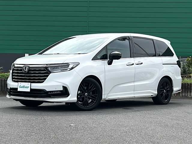 ホンダ オデッセイ ハイブリッド e:HEVアブソルート EXブラックED 茨城県 2023(令5)年 0.4万km プラチナホワイトパール ホンダセンシング/純正11.4インチナビ/ブラインドスポットモニター/衝突軽減システム/レーンキープアシスト/横滑り防止装置/バックカメラ/全周囲カメラ/マルチビューカメラ/両側パワースライドドア/パワーバックドア/レーダークルーズコントロール/LEDオートライト/オートマチックハイビーム/レザーシート/シートヒーター/パワーシート/純正18アルミホイール/SOSボタン/パドルシフト/ワイアレス充電/HDMI/USB入力端子/ETC