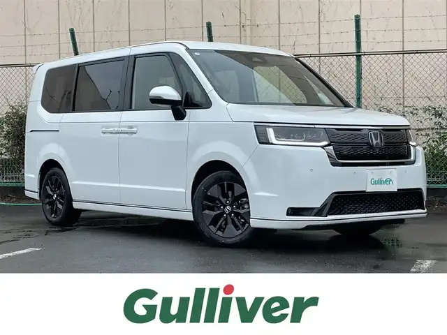 ホンダ ステップワゴン スパーダ 東京都 2025(令7)年 0.1千km プラチナホワイトパール 登録済未使用車/バックカメラ/追従クルーズ/ブラインドスポットインフォメーション/前席シートヒーター/パワーテールゲート/両側パワースライドドア/全列USBチャージャー/衝突軽減ブレーキ/純正アルミ