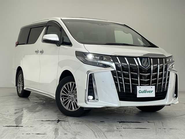 トヨタ アルファードハイブリット エグゼクティブ ラウンジ S 沖縄県 2022(令4)年 2万km ホワイトパールクリスタルシャイン 純正10インチメーカーナビ/　+JBLプレミアムサウンドシステム/　（フルセグTV/CD/DVD/Bluetooth）/パノラミックビューモニター/トヨタセーフティセンス/・衝突軽減ブレーキ/・レーントレーシングアシスト/・アダプティブクルーズコントロール/・ロードサインアシスト/・オートマチックハイビーム/ETC/ドライブレコーダー/12インチフリップダウンモニター/サンルーフ/両側パワースライドドア/パワーバックドア/シートメモリー付パワーシート/レザーシート/シートシーター/エアシート/オットマン/デジタルインナーミラー/ブラインドスポットモニター/前席、2列目シートエアコン/ステアリングエアコン/ステアリングヒーター/クリアランスソナー/LEDヘッドライト/オートライト