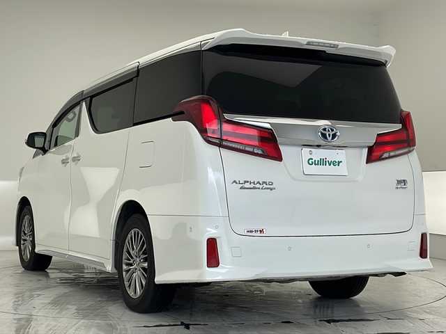 トヨタ アルファードハイブリット エグゼクティブ ラウンジ S 沖縄県 2022(令4)年 2万km ホワイトパールクリスタルシャイン 純正10インチメーカーナビ/　+JBLプレミアムサウンドシステム/　（フルセグTV/CD/DVD/Bluetooth）/パノラミックビューモニター/トヨタセーフティセンス/・衝突軽減ブレーキ/・レーントレーシングアシスト/・アダプティブクルーズコントロール/・ロードサインアシスト/・オートマチックハイビーム/ETC/ドライブレコーダー/12インチフリップダウンモニター/サンルーフ/両側パワースライドドア/パワーバックドア/シートメモリー付パワーシート/レザーシート/シートシーター/エアシート/オットマン/デジタルインナーミラー/ブラインドスポットモニター/前席、2列目シートエアコン/ステアリングエアコン/ステアリングヒーター/クリアランスソナー/LEDヘッドライト/オートライト