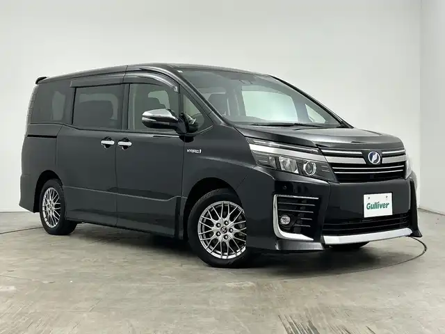 トヨタ ヴォクシー ハイブリッド ZS 煌Ⅱ 三重県 2016(平28)年 2.7万km ブラック /純正9型ナビ（フルセグ/CD/DVD/BT/AM/FM/SD)// バックカメラ //12.8型フリップダウンモニター //両側パワスラ //LEDヘッドライト //前後コーナーセンサー //オートマチックハイビーム //トヨタセーフティーセンス//レーンキープアシスト//TVキャンセラー//スマートキー