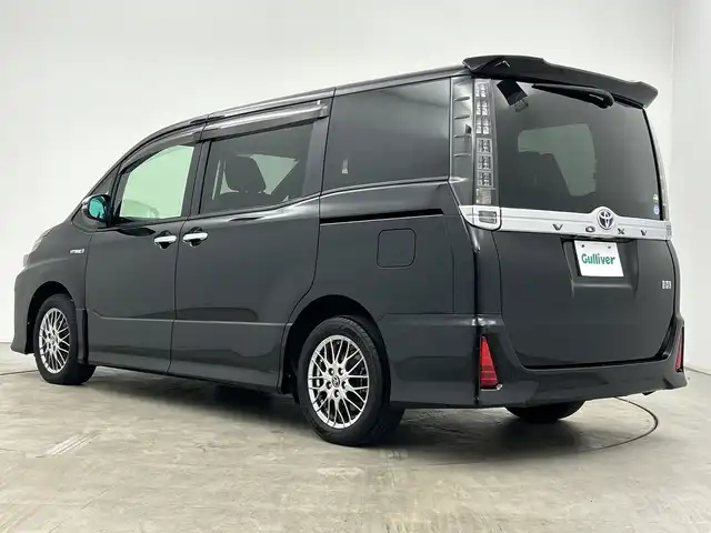 トヨタ ヴォクシー ハイブリッド ZS 煌Ⅱ 三重県 2016(平28)年 2.7万km ブラック /純正9型ナビ（フルセグ/CD/DVD/BT/AM/FM/SD)// バックカメラ //12.8型フリップダウンモニター //両側パワスラ //LEDヘッドライト //前後コーナーセンサー //オートマチックハイビーム //トヨタセーフティーセンス//レーンキープアシスト//TVキャンセラー//スマートキー