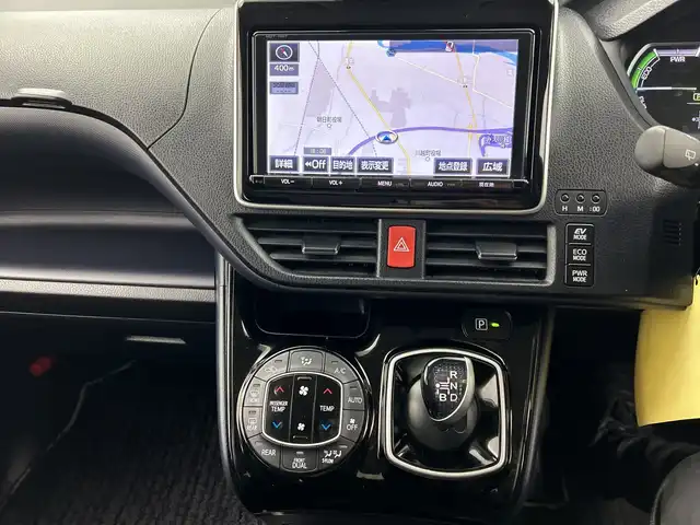 トヨタ ヴォクシー ハイブリッド ZS 煌Ⅱ 三重県 2016(平28)年 2.7万km ブラック /純正9型ナビ（フルセグ/CD/DVD/BT/AM/FM/SD)// バックカメラ //12.8型フリップダウンモニター //両側パワスラ //LEDヘッドライト //前後コーナーセンサー //オートマチックハイビーム //トヨタセーフティーセンス//レーンキープアシスト//TVキャンセラー//スマートキー