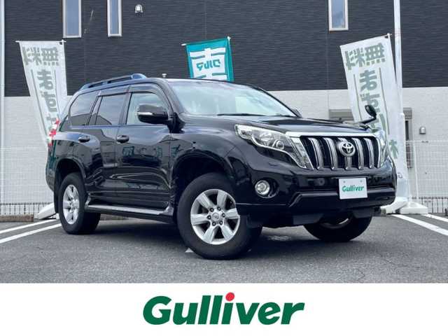 トヨタ ランドクルーザー プラド TX Lパッケージ 三重県 2014(平26)年 10.2万km ブラック 登録時101114km/禁煙車/黒革シート/ルーフレール/社外ナビ(AM/FM/CD/DVD/ワンセグ/Bluetooth)/前席シートヒーター/運転席パワーシート/前方ドライブレコーダー/ＥＴＣ/クルーズコントロール/オートライト/横滑り防止装置/電格ミラー/プッシュスタート/スマートキー×２