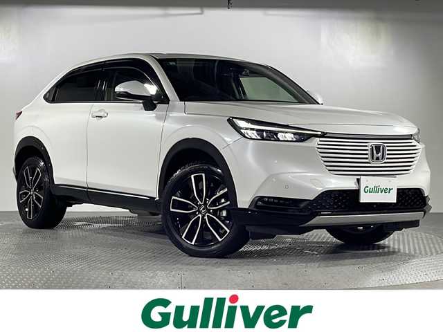 ホンダ ヴェゼル ハイブリッド e:HEV Z 沖縄県 2021(令3)年 4.1万km プラチナホワイトパール 禁煙車/県外車両/8インチナビ（CD/DVD/HDMI/Bluetooth）/ホンダセンシング/バックカメラ/レザー調シートカバー/ステアリングスイッチ/クルーズコントロール/パワーバックドア/社外ウーハー/ステアリングヒーター/ブラインドスポットモニター