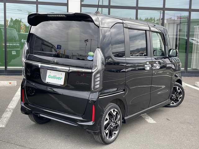 ホンダ Ｎ ＢＯＸ カスタム G EX ホンダセンシング 道東・釧路十勝 2017(平29)年 2.1万km クリスタルブラックパール ・４WD/・ホンダセンシング/・純正ギャザースナビ/　（AM FM CD DVD BT SD TV）/・両側パワースライドドア/・アダプティブクルーズコントロール/・スマートキー/・プッシュスタート/・衝突軽減ブレーキ/・誤発進抑制機能/・歩行者事故低減ステアリング/・路外逸脱抑制機能/・ビークル・スタビリティ・アシスト/・革巻きステアリング/・ステアリングスイッチ/・ビルトインETC/・パドルシフト/・ミラーヒーター/・ハーフレザーシート/・前席シートヒーター/・オートライト/・LEDライト/・フロントフォグランプ/・社外アルミホイール付き冬タイヤ積込/（165/55/15 2017年製造　5分山）