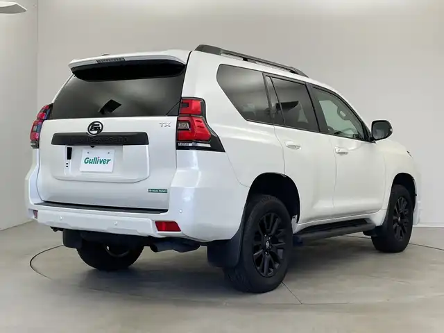 トヨタ ランドクルーザー プラド TX Lパッケージ マットブラED 新潟県 2023(令5)年 3.2万km ホワイトパールクリスタルシャイン サンルーフ/7人乗り/ベージュ革シート/プリクラッシュセーフティ/レーダークルーズコントロール/レーンキープアシスト/パーキングサポートブレーキ/ALPINEナビ/　・フルセグTV/　・CD/DVD/SD再生機能/　・Apple car play/　・HDMI/ALPINEフリップダウンモニター/ETC/パワーシート/電動格納サードシート/エアシート/シートヒーター/M’s SPEEDフロントハーフスポイラー/オートライト/オートハイビーム/LEDヘッドライト/プッシュスタート/社外ラバーマット/ステアリングスイッチ/オートドアミラー