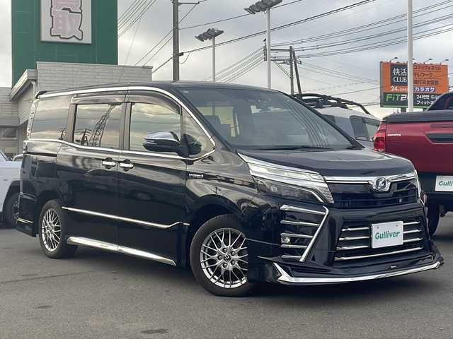 トヨタ ヴォクシー ハイブリッド ZS 煌 山口県 2018(平30)年 4.4万km ブラック ALPINE １１インチナビ【EX11Z】/CD/DVD/フルセグTV/Bluetooth/USB/SD/AM/FM/ALPINE 12.8インチフリップダウンモニター【PXH12X-R】/ALPINE ドライブレコーダー/モデリスタエアロ /バックカメラ /衝突軽減ブレーキ/クルーズコントロール/レーンキープアシスト/プッシュスタート /スペアキー/シーケンシャル/ワイパーデアイサー/オートライト /オートマチックハイビーム/フォグランプ/サイドステップガーニッシュ/スパーウェルカムライティングキット/社外マフラー