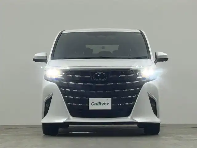 トヨタ アルファードハイブリット Z 千葉県 2024(令6)年 1.4万km プラチナホワイトパールマイカ 禁煙車/両側電動ドア/パワーバックドア/トヨタセーフティセンス/・レーンディパーチャーアラート/・レーンキープアシスト/・ブラインドスポットモニター/・プリクラッシュセーフティ/・プリクラッシュセーフティブレーキ/・クリアランスソナー/・レーダークルーズコントロール/純正14インチディスプレイオーディオ/・コネクティッドナビ付き/・Bluetooth/フルセグTV/・パノラミックビューモニター/・ビルトインETC2.0/・デジタルインナーミラー/左右独立エアコン/置くだけ充電/革巻きステアリング/・ステアリングスイッチ/・ステアリングヒーター/レザーシート/・D席メモリ付き/・DNセカンドパワーシート/・DNセカンドシートヒーター/・DNセカンドエアーシート/・オットマン/電子パーキング/・ブレーキホールド/オートライト/・オートマチックハイビーム/・三眼LEDヘッドライト/・LEDフォグランプ/・シーケンシャルウインカー/純正フロアマット/純正18インチAW