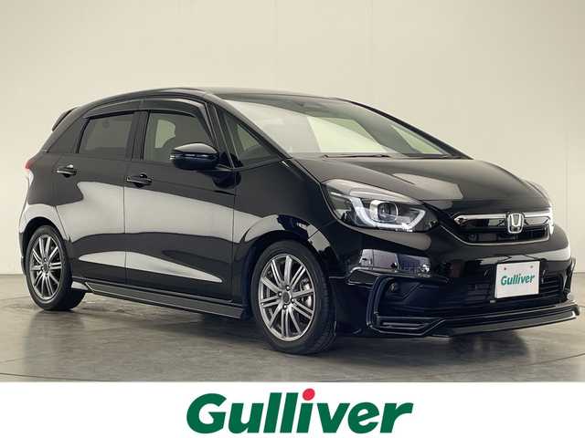 ホンダ フィット e:HEVホーム 宮崎県 2022(令4)年 2.9万km クリスタルブラックパール 禁煙車/ホンダセンシング/純正8型ナビTV/（Gathers/VXM-215VFEi/CD/DVD/Bluetooth/フルセグTV)/純正バックカメラ/純正前後ドライブレコーダー/純正OPエアロ/純正OPルーフエンドスポイラー/純正ビルトインETC/純正LEDオートライト/純正LEDフォグ/純正フロアマット/社外16インチアルミ/アダプティブクルーズコントロール/レーンディパーチャーアラート/オートマチックハイビーム/クリアランスソナー/電子パーキング/オートホールド/ウインカードアミラー/オートエアコン/ハーフレザーシート/本革巻ハンドル/スマートキー/プッシュエンジンスタート/スペアキー/新車時保証書/取扱い説明書