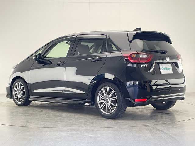ホンダ フィット e:HEVホーム 宮崎県 2022(令4)年 2.9万km クリスタルブラックパール 禁煙車/ホンダセンシング/純正8型ナビTV/（Gathers/VXM-215VFEi/CD/DVD/Bluetooth/フルセグTV)/純正バックカメラ/純正前後ドライブレコーダー/純正OPエアロ/純正OPルーフエンドスポイラー/純正ビルトインETC/純正LEDオートライト/純正LEDフォグ/純正フロアマット/社外16インチアルミ/アダプティブクルーズコントロール/レーンディパーチャーアラート/オートマチックハイビーム/クリアランスソナー/電子パーキング/オートホールド/ウインカードアミラー/オートエアコン/ハーフレザーシート/本革巻ハンドル/スマートキー/プッシュエンジンスタート/スペアキー/新車時保証書/取扱い説明書