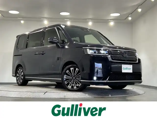 ホンダ ステップワゴン スパーダ eHEV プレミアムライン 愛知県 2022(令4)年 1.7万km トワイライトミストブラックパール 純正9インチナビ/（AM/FM/CD/DVD/USB/Bluetooth/フルセグTV）/両側電動スライドドア/ホンダセンシング/・レーダークルーズコントロール/・レーンキープアシスト/・ブラインドスポットモニター/・パーキングセンサー/・衝突軽減ブレーキ/・標識認識機能/アラウンドビューモニター/LEDヘッドライト/1列目・2列目シートヒーター/ETC/バックカメラ/ドライブレコーダー/ブラインドスポットモニター/電動リアゲート/プッシュスタート/コーナーセンサー/パドルシフト/2列目オットマン/スマートキー/ミュージックサーバー/ミュージックプレイヤー接続/オートライト