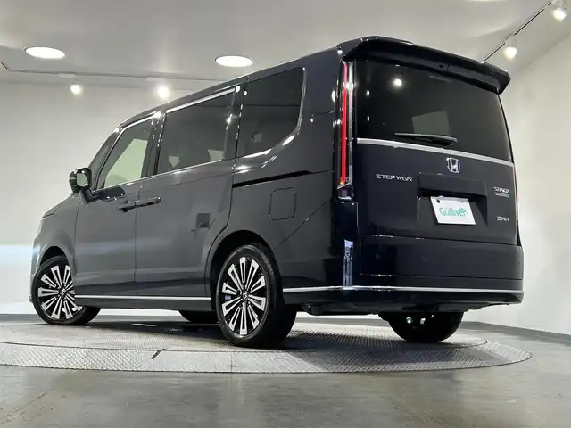 ホンダ ステップワゴン スパーダ eHEV プレミアムライン 愛知県 2022(令4)年 1.7万km トワイライトミストブラックパール 純正9インチナビ/（AM/FM/CD/DVD/USB/Bluetooth/フルセグTV）/両側電動スライドドア/ホンダセンシング/・レーダークルーズコントロール/・レーンキープアシスト/・ブラインドスポットモニター/・パーキングセンサー/・衝突軽減ブレーキ/・標識認識機能/アラウンドビューモニター/LEDヘッドライト/1列目・2列目シートヒーター/ETC/バックカメラ/ドライブレコーダー/ブラインドスポットモニター/電動リアゲート/プッシュスタート/コーナーセンサー/パドルシフト/2列目オットマン/スマートキー/ミュージックサーバー/ミュージックプレイヤー接続/オートライト