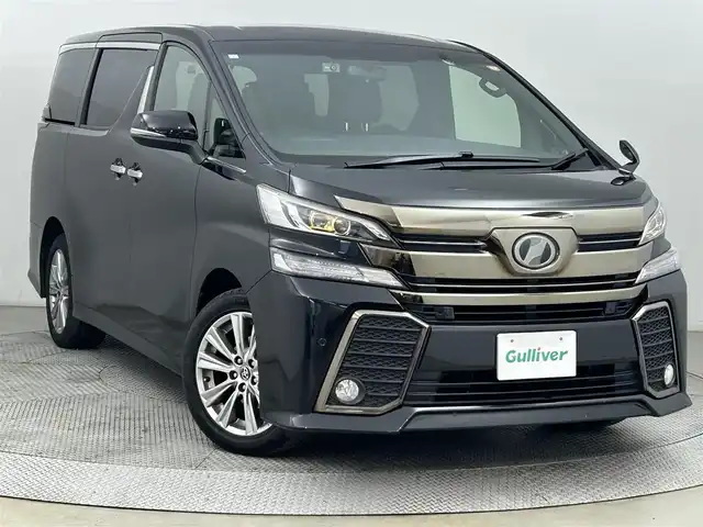 トヨタ ヴェルファイア 2.5Z Aエディデョン ゴールデンアイズ 道央・札幌 2017(平29)年 10.4万km ブラック ・ワンオーナー車/・４WD/・寒冷地仕様/・アルパインナビゲーション（EX11V）/　CD/DVD/フルセグ/SD/BT/・アルパイン12.8インチフリップダウンモニター/   （プラズマクラスター付）/・社外ドライブレコーダー前後（ZDR025）/・ビルトインETC/・レーダー探知機/・両側パワースライドドア/・オートブレーキホールド/・レーダークルーズコントロール/・インテリジェントクリアランスソナー/・ハーフレザーシート/・F/Rフォグランプ/・リモートスタート一体型スマートキー/・プッシュスタート/・スペアキー１本/・純正AW18インチ＋夏タイヤ/・社外AW16インチ＋冬タイヤ積込/・保証書付き/・取説付き/・MTモード付AT/・電動格納ウィンカーミラー/・ステアリングスイッチ/・nanoe