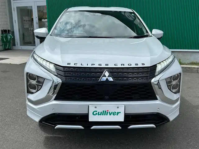 三菱 エクリプス クロス ＰＨＥＶ P 宮城県 2020(令2)年 8.3万km ホワイトダイヤモンド e-アシスト/・衝突被害軽減ブレーキシステム/・車線逸脱警報システム/・レーダークルーズコントロール/・オートマチックハイビーム/・誤発進抑制機能/・後側方車両検知警報システム/・後退時車両検知警報システム/スマートフォン連携ナビゲーション/・Bluetooth/・フルセグTV/マルチアラウンドモニター/ETC/AC100V/1500W電源/ヘッドアップディスプレイ/ハーフレザーシート/パワーシート/シートヒーター/ステアリングヒーター/LEDヘッドランプ/LEDフロントフォグランプ/オートライト/スマートキー＆プッシュスタート/電動格納ミラー/純正１８インチアルミホイール/純正フロアマット/スペアキー
