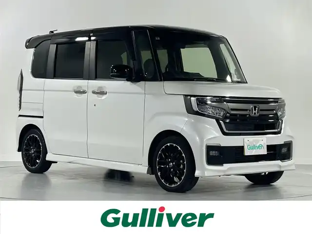 ホンダ Ｎ ＢＯＸ カスタム L ターボ 佐賀県 2021(令3)年 6.1万km プラチナホワイトパール 純正ナビ　VXU-217NBi/BT/CD/DVD/FM/AM/SD/USB//フルセグTV/バックカメラ/ホンダセンシング/衝突軽減ブレーキ/レーンキープアシスト/路外逸脱抑制システム/先行車発進告知/標識認識システム/クルーズコントロール/コーナーセンサー/横滑り防止システム/ビルトインETC/前後ドライブレコーダー/革巻きステアリング/ステアリングスイッチ/パドルシフト/オートライト/LEDライト/フォグランプ/ヘッドライトレベライザー/合皮シート/D/N席シートヒーター/純正フロアマット/電動格納ミラー/ウインカーミラー/ドアバイザー/ダブル＆サイド＆カーテンエアバック/プッシュスタート/スマートキー/スペアキーｘ１