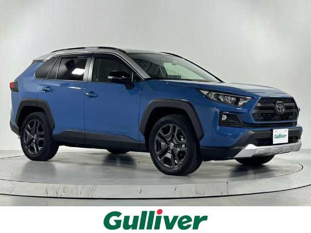 トヨタ ＲＡＶ４ アドベンチャー 佐賀県 2023(令5)年 0.2万km アッシュグレーメタリック/グレイッシュブルー 純正10.5型ナビ/（ＡＭ/ＦＭ/CD/DVD/Bluetooth/フルセグTV）/バックカメラ/クルーズコントロール(追従あり)/前後ドライブレコーダー/衝突被害軽減システム/ビルトインETC/レーンアシスト/コーナーセンサー/シートヒーター/エアシート/LEDヘッドライト/デュアルエアコン/盗難防止装置/横滑り防止装置/オートライト/オートマチックハイビーム/スマートキー/プッシュスタート/純正フロアマット/純正19インチアルミホイール/ステアリングスイッチ/電動格納ミラー