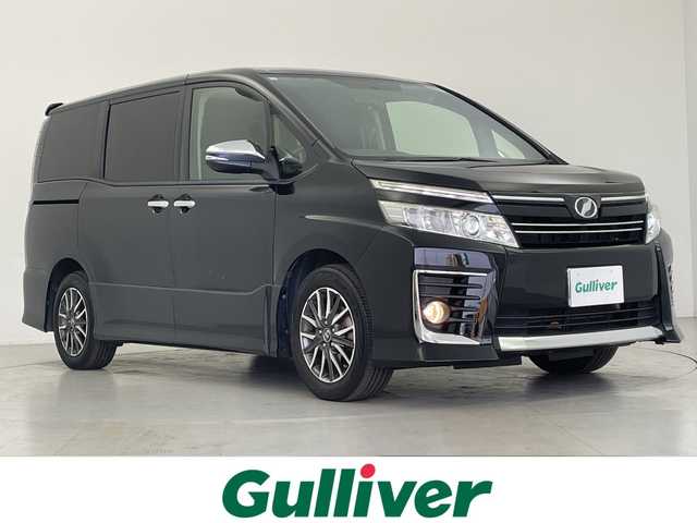 トヨタ ヴォクシー ZS 煌 愛知県 2015(平27)年 6.9万km ブラック プッシュスタート/純正ナビ/（CD・DVD・フルセグTV・BTオーディオ・SD）/バックカメラ/ビルトインETC/純正フリップダウンモニター（V11T-R62C）/純正16インチAW/両側パワースライドドア/LEDヘッドライト/オートライト/フォグライト/横滑り防止装置/ウィンカーミラー/純正フロアマット/新車保証書/取扱説明書/スマートスペアキー×1本