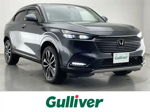 ホンダ ヴェゼル ハイブリッド e:HEV Z 愛知県 2021(令3)年 6.5万km メテオロイドグレーメタリック 純正９型ナビＴＶ　全方位カメラ　禁煙　ホンダセンシング　ハーフレザー　シートヒーター　電動リアゲート　ハンドルヒーター　ＢＳＭ　ＥＴＣ２．０　前後ドラレコ　衝突軽減　追従クルコン　ハンドル支援　ＬＥＤ　ワイヤレス充電