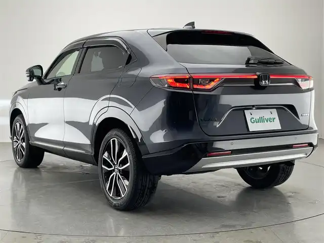 ホンダ ヴェゼル ハイブリッド e:HEV Z 愛知県 2021(令3)年 6.5万km メテオロイドグレーメタリック 純正９型ナビＴＶ　全方位カメラ　禁煙　ホンダセンシング　ハーフレザー　シートヒーター　電動リアゲート　ハンドルヒーター　ＢＳＭ　ＥＴＣ２．０　前後ドラレコ　衝突軽減　追従クルコン　ハンドル支援　ＬＥＤ　ワイヤレス充電