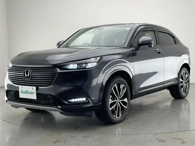 ホンダ ヴェゼル ハイブリッド e:HEV Z 愛知県 2021(令3)年 6.5万km メテオロイドグレーメタリック 純正９型ナビＴＶ　全方位カメラ　禁煙　ホンダセンシング　ハーフレザー　シートヒーター　電動リアゲート　ハンドルヒーター　ＢＳＭ　ＥＴＣ２．０　前後ドラレコ　衝突軽減　追従クルコン　ハンドル支援　ＬＥＤ　ワイヤレス充電
