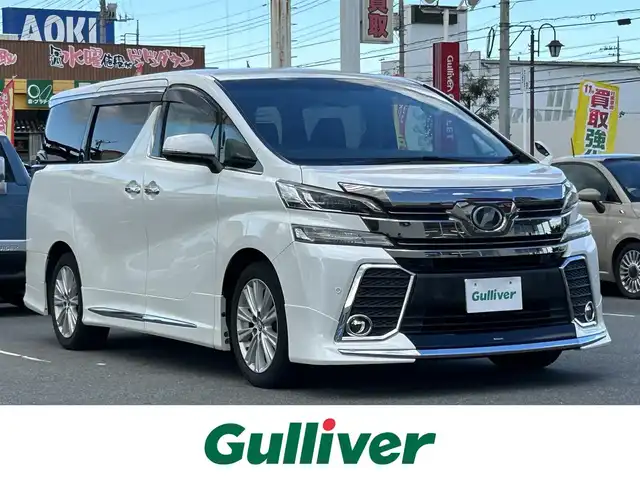 トヨタ ヴェルファイア Z Aエディション 群馬県 2015(平27)年 6.5万km ホワイトパールクリスタルシャイン ワンオーナー/モデリスタエアロ(F/S/R)/純正9インチナビ/CD・DVD・SD・BT・フルセグ/両側パワースライドドア/バックカメラ/純正エンジンスターター/純正ドライブレコーダー/ビルトインETC/レーダークルーズコントロール/横滑り防止装置/レーンキープアシスト/衝突軽減ブレーキ/LEDヘッドライト/純正アルミホイール/純正フロアマット/取説・保証書/スマートキー×2