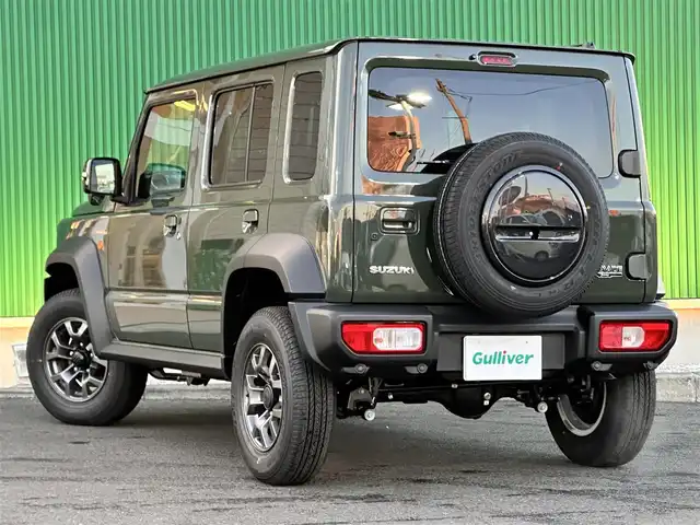 スズキ ジムニー ノマド FC 東京都 2025(令7)年 0.1千km ジャングルグリーン ワンオーナー/パートタイム4WD/衝突被害軽減ブレーキ/純正LEDオートライト/純正フォグ/純正セキュリティアラーム/アダプティブクルーズコントロール/レーンディパーチャーアラート/クリアランスソナー/ダウンヒルアシストコントロール/ウインカードアミラー/本革巻ハンドル/前席シートヒーター/オートエアコン/スマートキー/プッシュエンジンスタート/スペアキー/新車時保証書/取扱い説明書